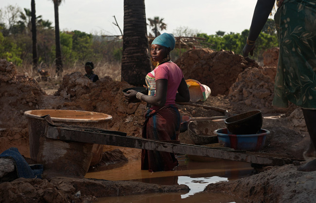 Many women are panning for gold, wading all day long in the water.
