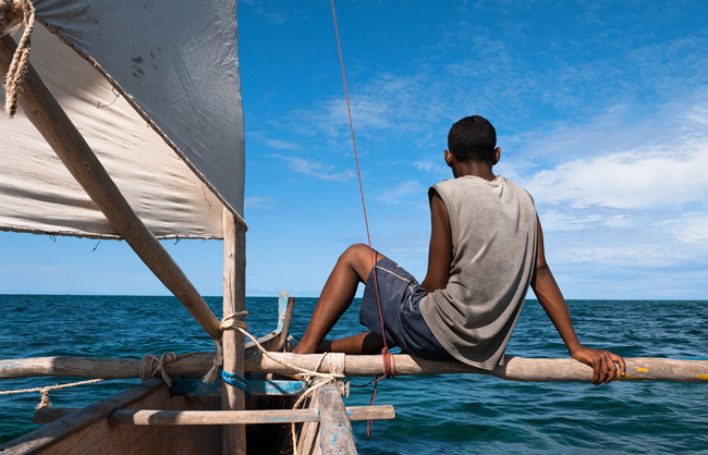 Fisherman on his traditional sailing boat in the Mozambique Channel