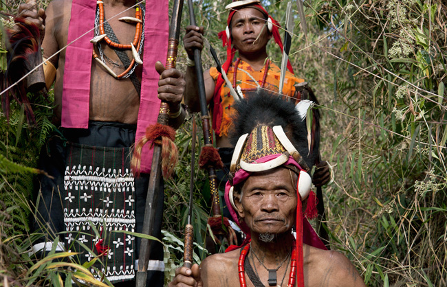 Makuri Naga warriors with their spears and their dao (traditional knife). The tattooed chest was traditionally only allowed to those who had taken part in a raid. The human figure was added to those who had participated in the death and took the head of an enemy.