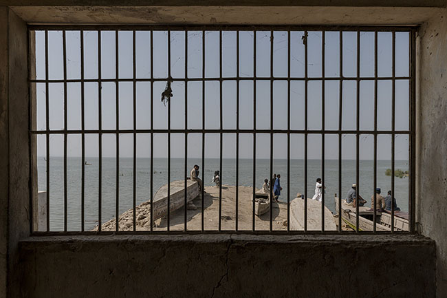 View of Lake Manchar from the grills of the only fish market. Once thriving, the Mohana fishing industry fed an entire region. Today, it is no longer enough to sustain families. And with it, an entire culture falters, drifting on a lake that is now but a mirage of what it once was.
