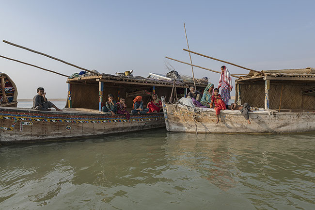 Mohana family aboard their houseboat. Once, more than 20,000 Mohanas lived on the Galiyo, their iconic floating homes. Today, only about forty remain, sheltering fewer than five hundred souls.
