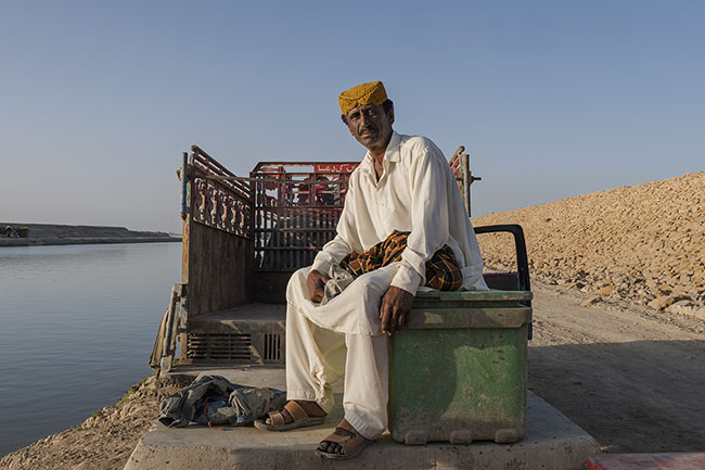 Portrait of Mansoor. This Mohana no longer lives by the lake but continues to come every day to transport the daily catch to the Karachi auction.