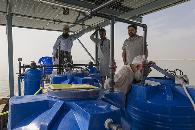 Shah Muhammad Tanweer and his team test the first mobile water purification unit using reverse osmosis, a glimmer of hope on Lake Manchar.
