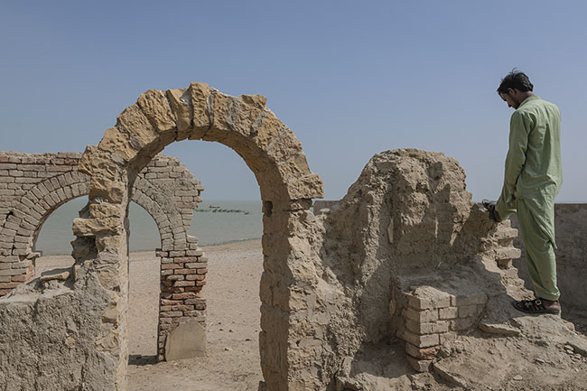 Facing Lake Manchar, the remnants of a British colonial building dating back to 1916 still whisper the echoes of a bygone era.